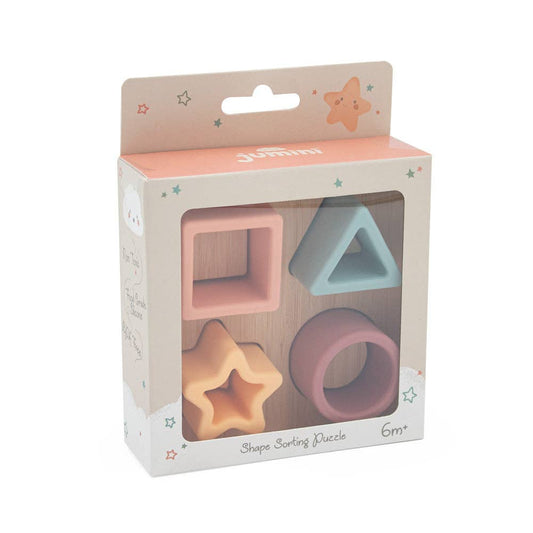Box of shape sorting puzzle with pastel-colored shapes on a white background