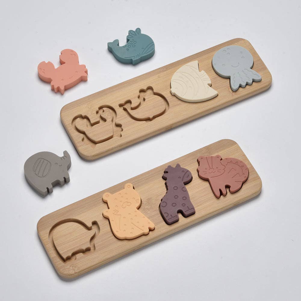 Wooden toy with animal-shaped cutouts on a light gray background