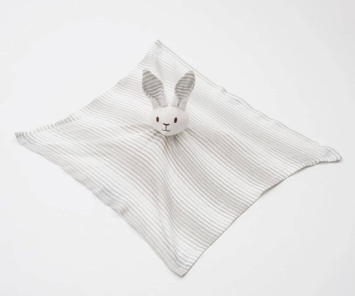 Striped baby comfort blanket with a rabbit plush toy on a white background