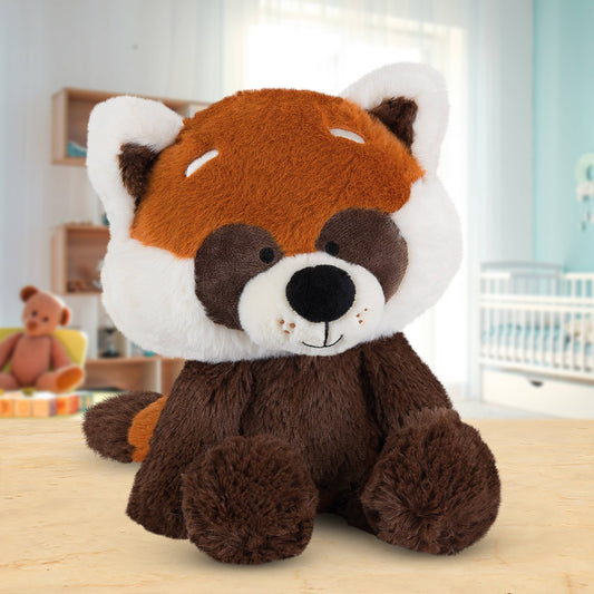 Plush toy red panda on a wooden surface with a blurred background