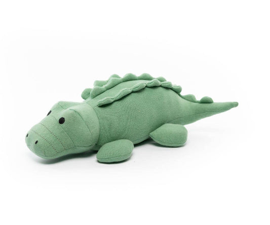 A large plush toy resembling a green crocodile made from organic cotton, suitable for babies.