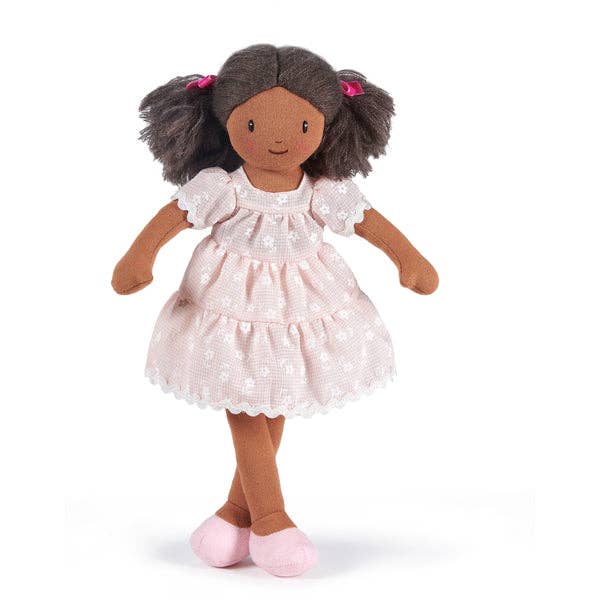 Doll with brown hair and a white dress on a white background