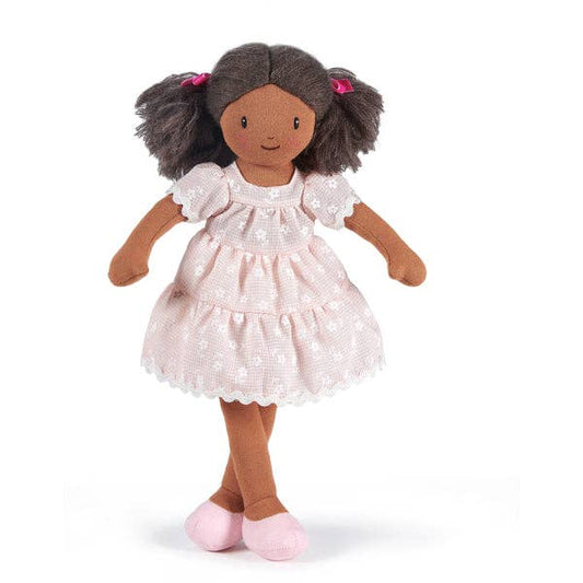 Doll with brown hair and a white dress on a white background