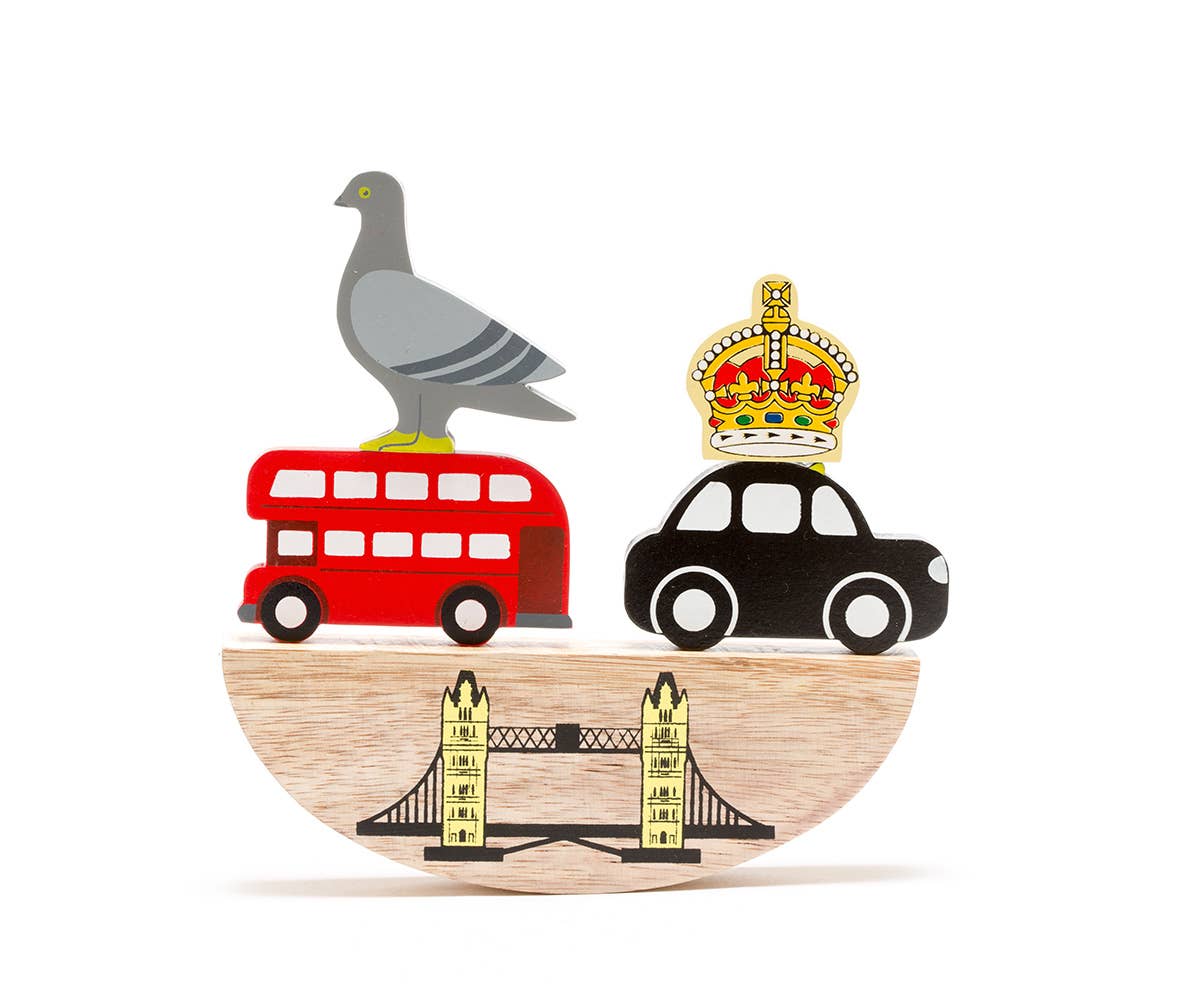 Handmade London-themed wooden balance toy featuring a red bus, black taxi, pigeon and Tower Bridge