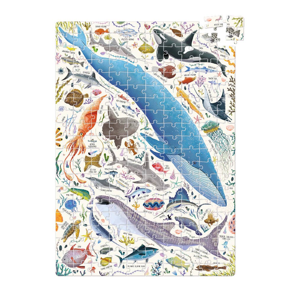 Jigsaw puzzle with ocean-themed illustrations on a white background