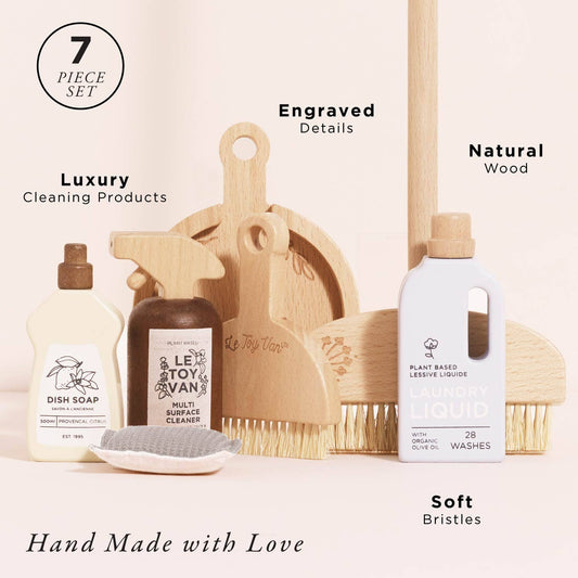Set of wooden toy cleaning products including bottles, scrubber, and brush with engraved details on a light background.