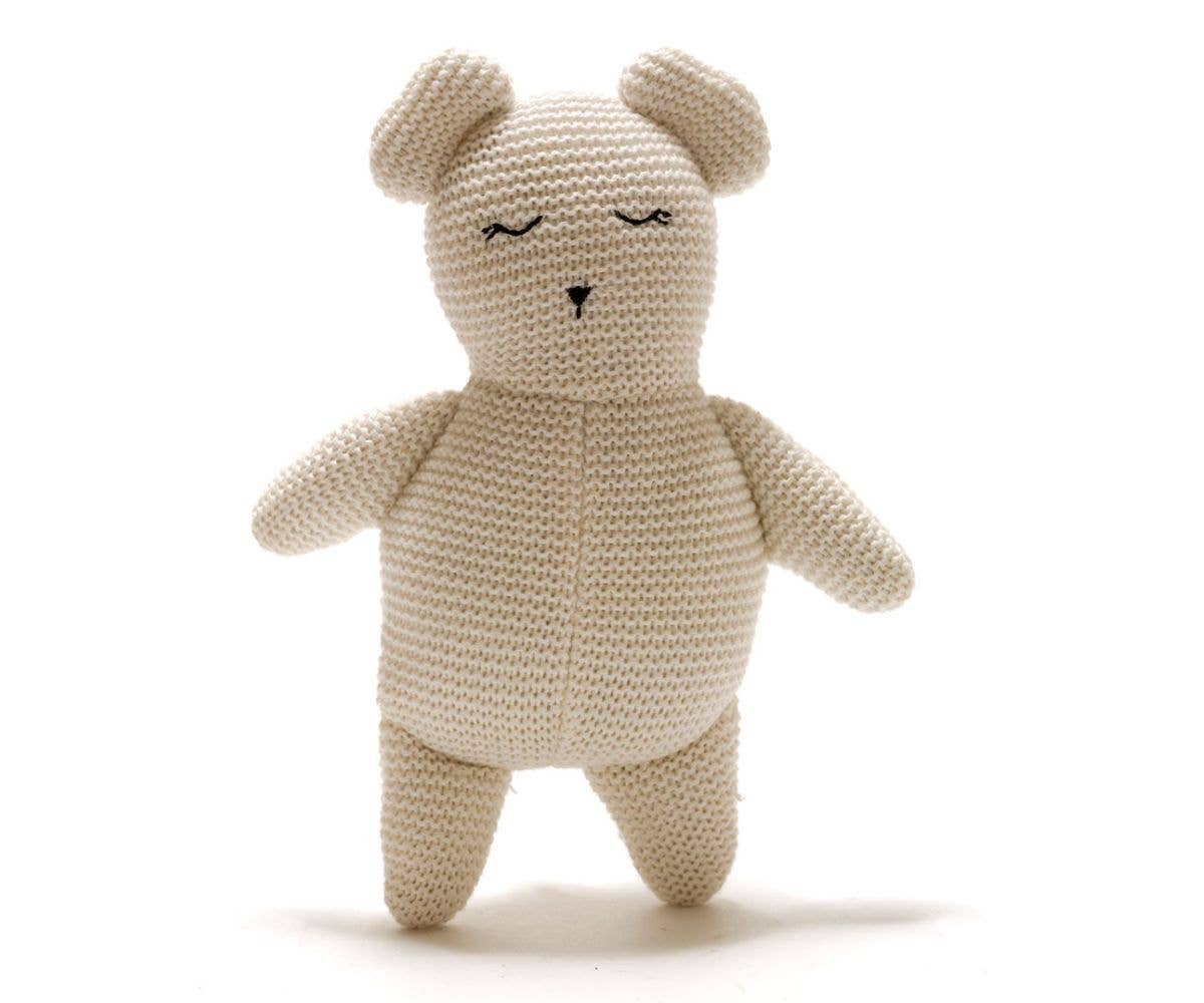 Knitted teddy bear toy on a white background