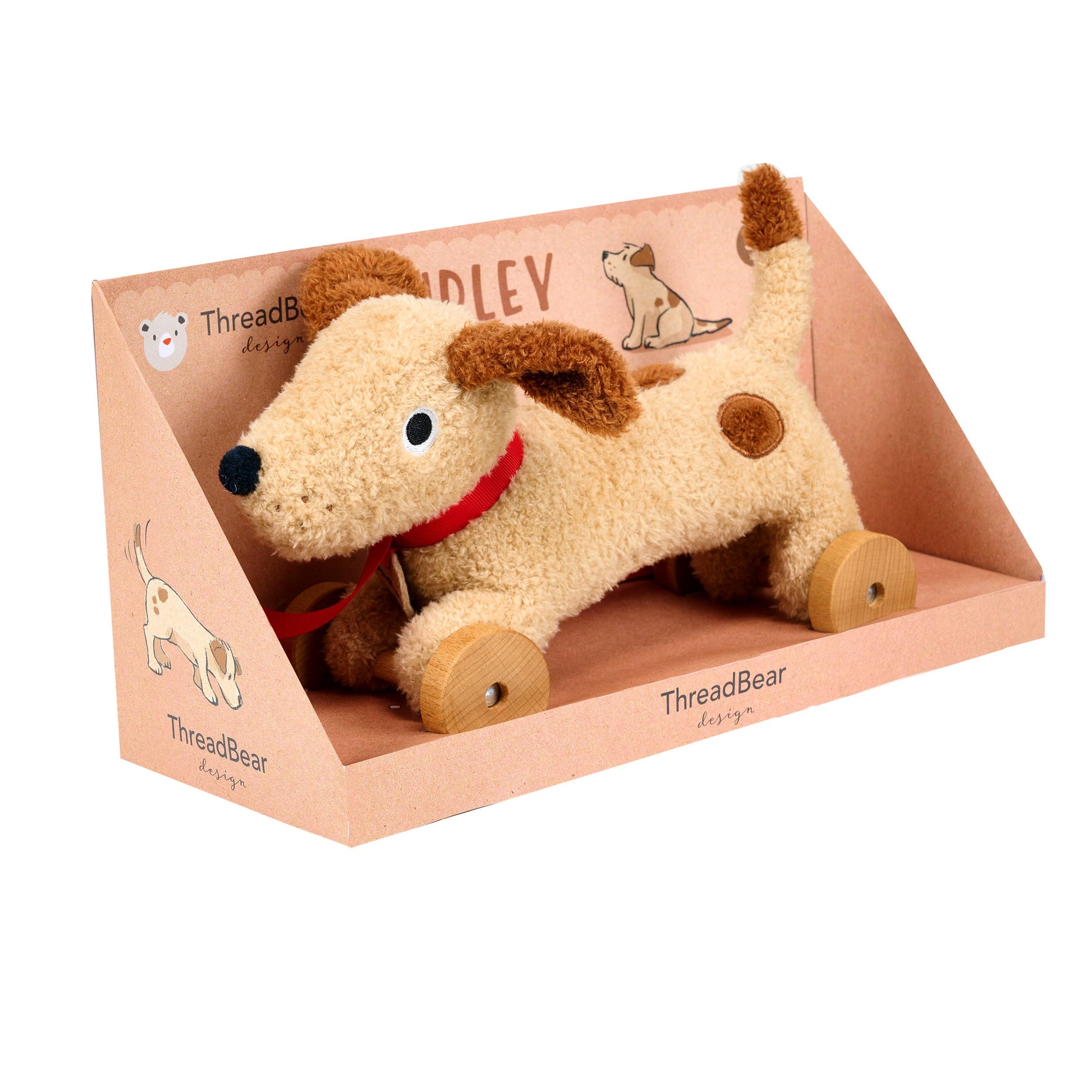 Plush dog toy with wheels in a 'ThreadBear' branded box on a white background