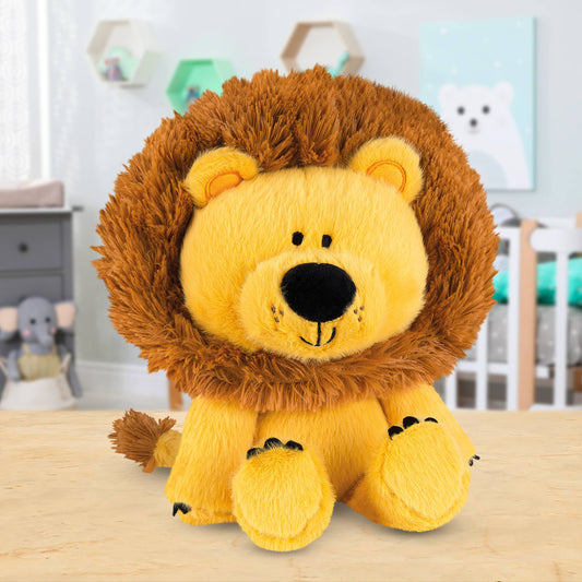 Plush lion toy on a wooden surface with a blurred nursery background
