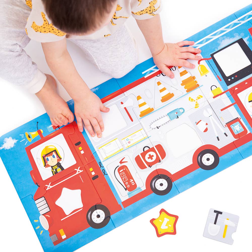 Child playing with a fire truck-themed educational mat