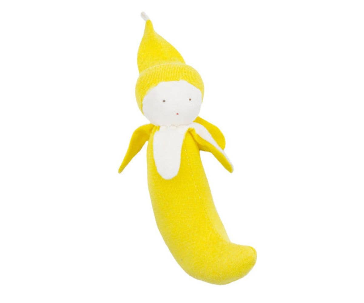 Yellow plush toy shaped like a banana on a white background