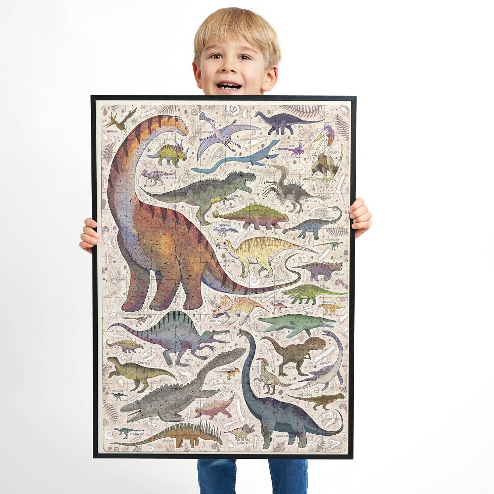 Child holding a framed poster of colorful dinosaur illustrations