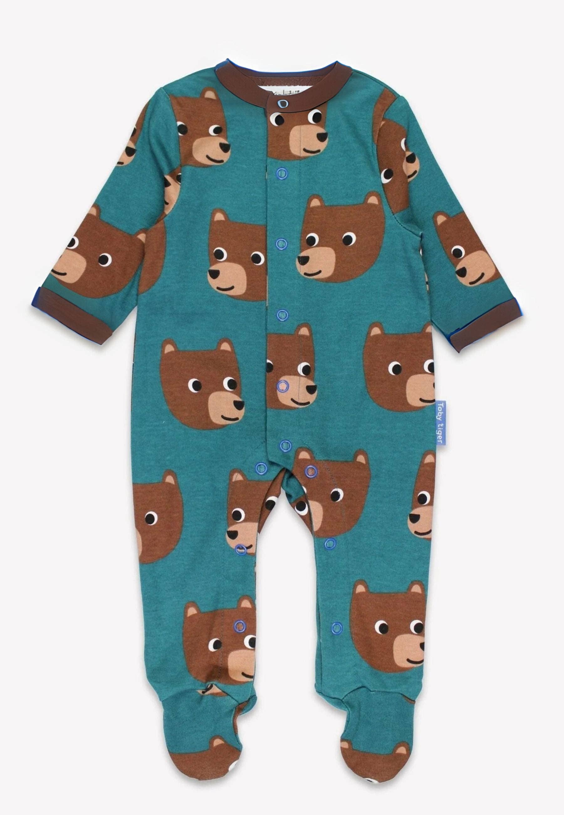 Teal baby onesie with bear pattern on a white background
