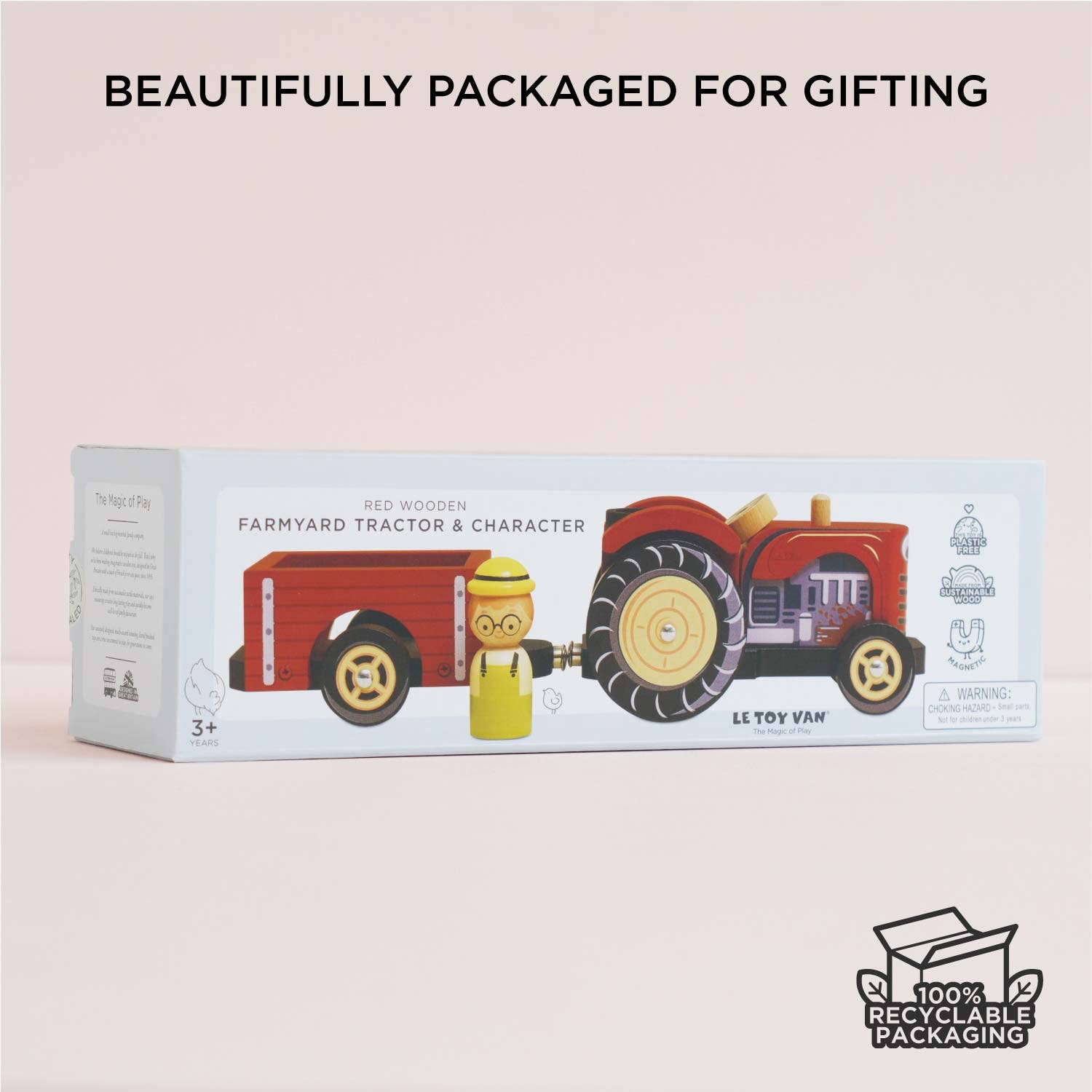 Toy tractor packaging with a child figure on a light pink background, featuring recyclable packaging logo.
