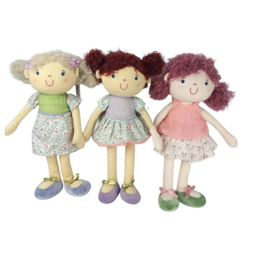 Three dolls with different hairstyles and colorful dresses on a white background
