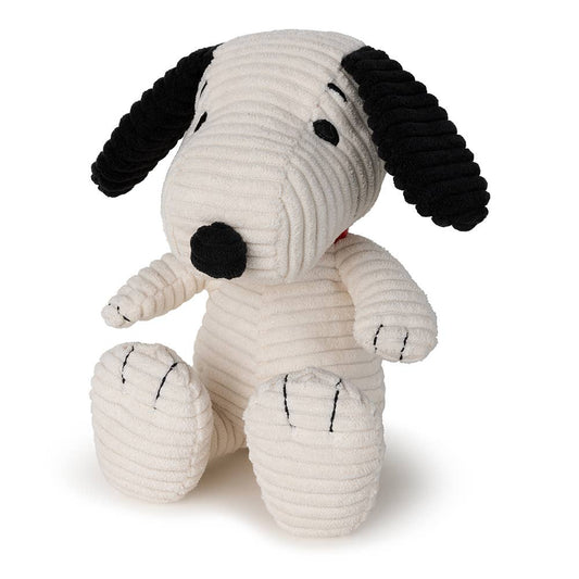Stuffed Snoopy dog toy with black ears and paws on a white background