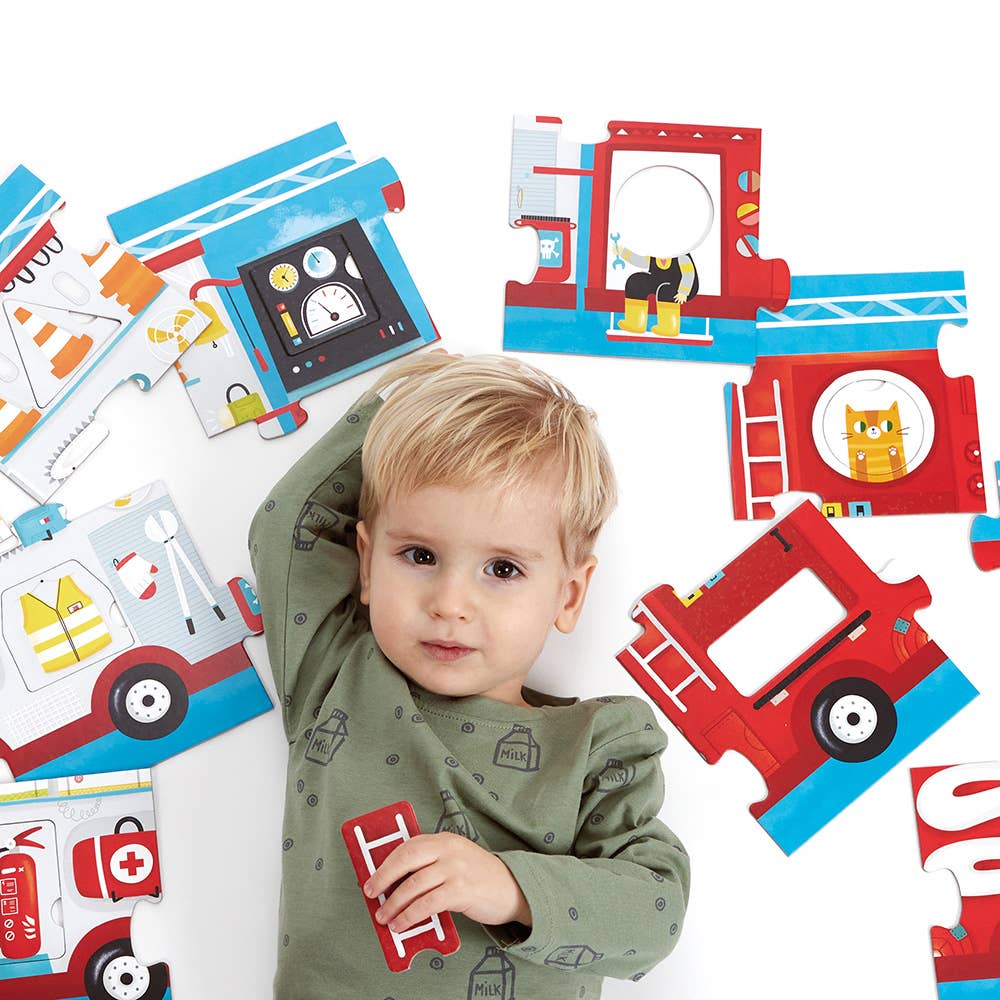 Child surrounded by colorful fire truck-themed educational toys on a white background