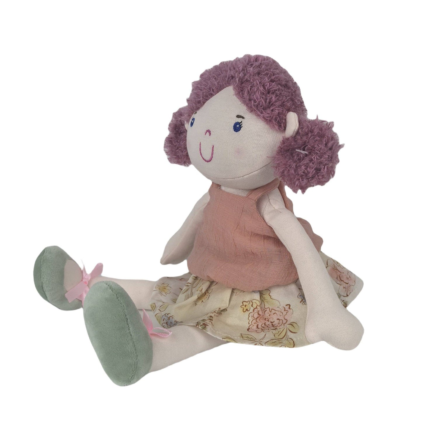 Plush toy doll with a pink top and floral skirt on a white background