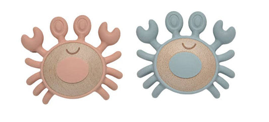 Two sun-shaped toys, one pink and one blue, on a white background.