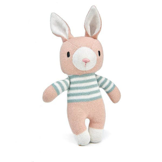 Knitted toy rabbit with a striped sweater on a white background