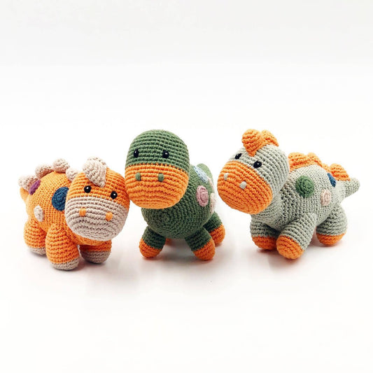 Three knitted dino toys