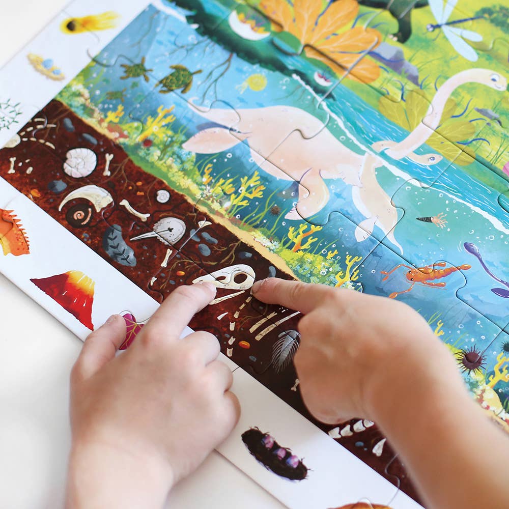 Children's hands interacting with a colorful puzzle featuring marine life.