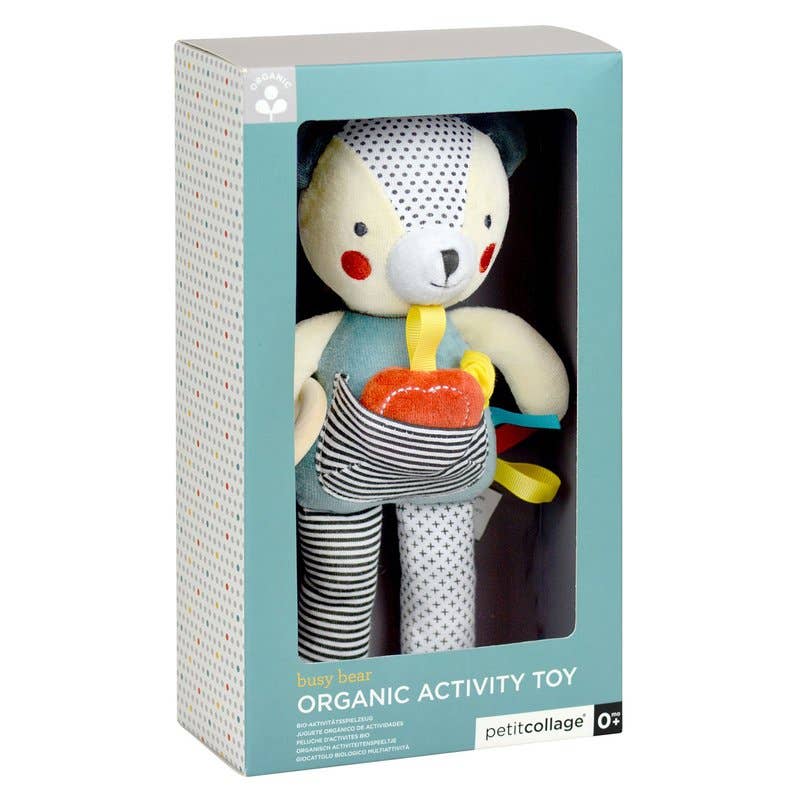 Plush toy bear in a box with 'petitcollage' branding
