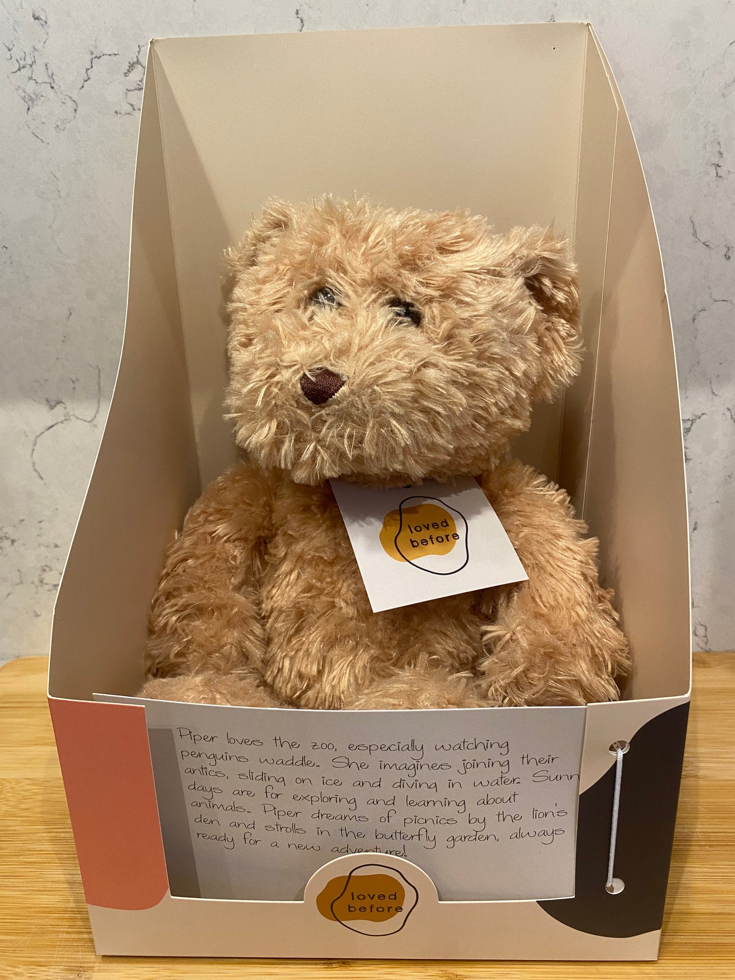 Teddy bear in a Loved Before box with a story card 