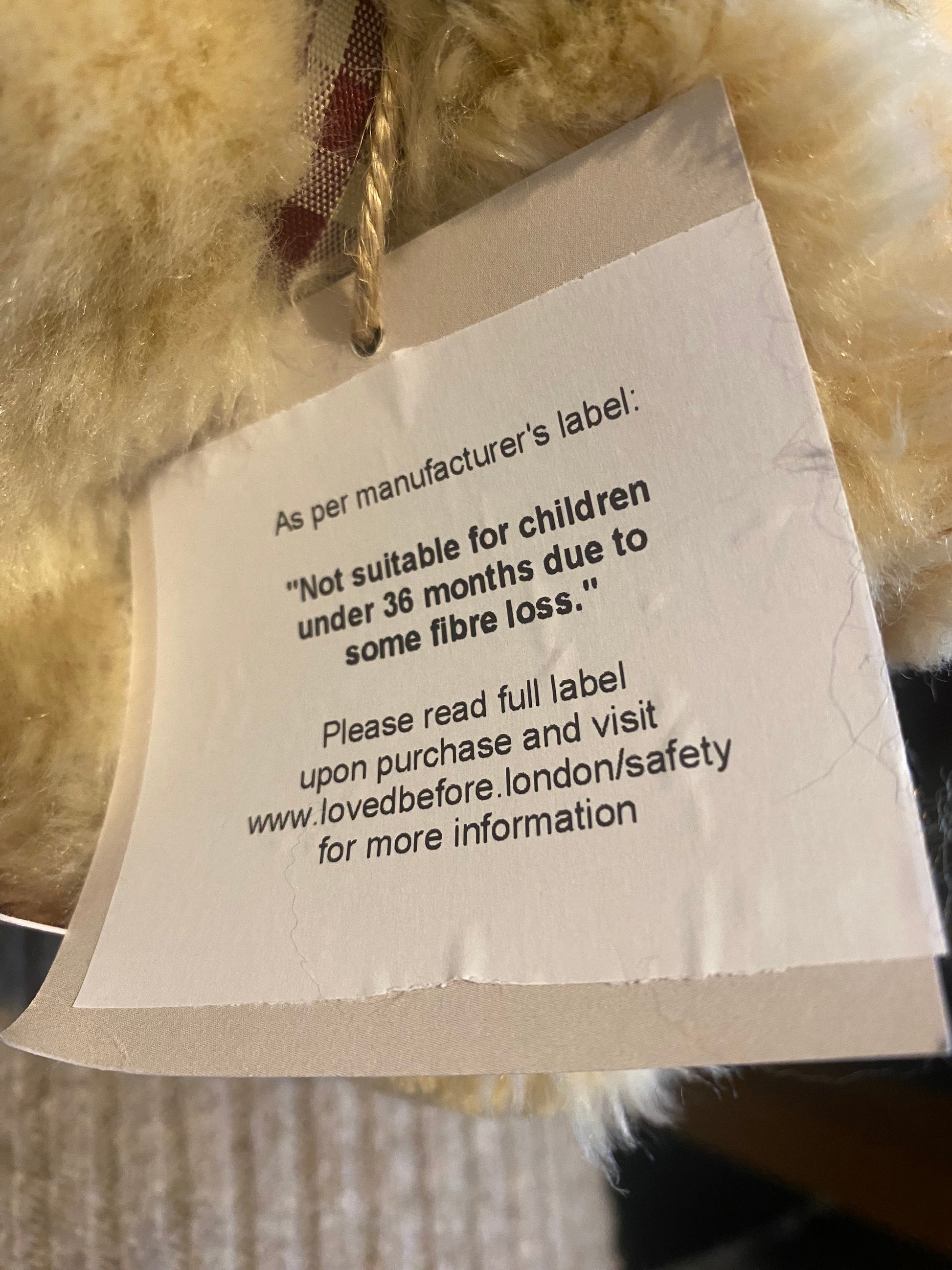 Text label on a fluffy fabric background