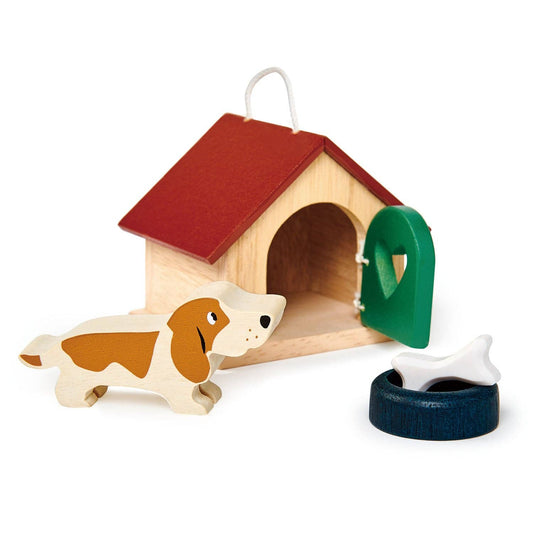 Wooden doghouse with a toy dog and tire swing on a white background