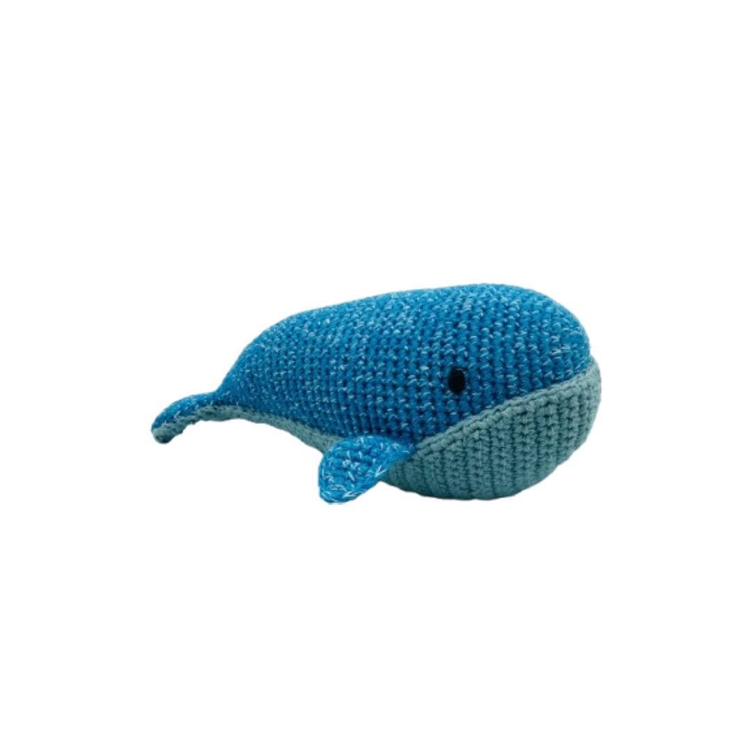 Knitted whale toy on a white background