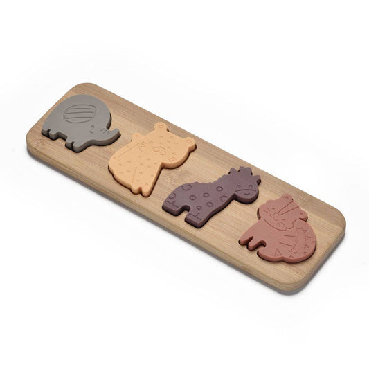 Wooden puzzle with animal shapes on a white background