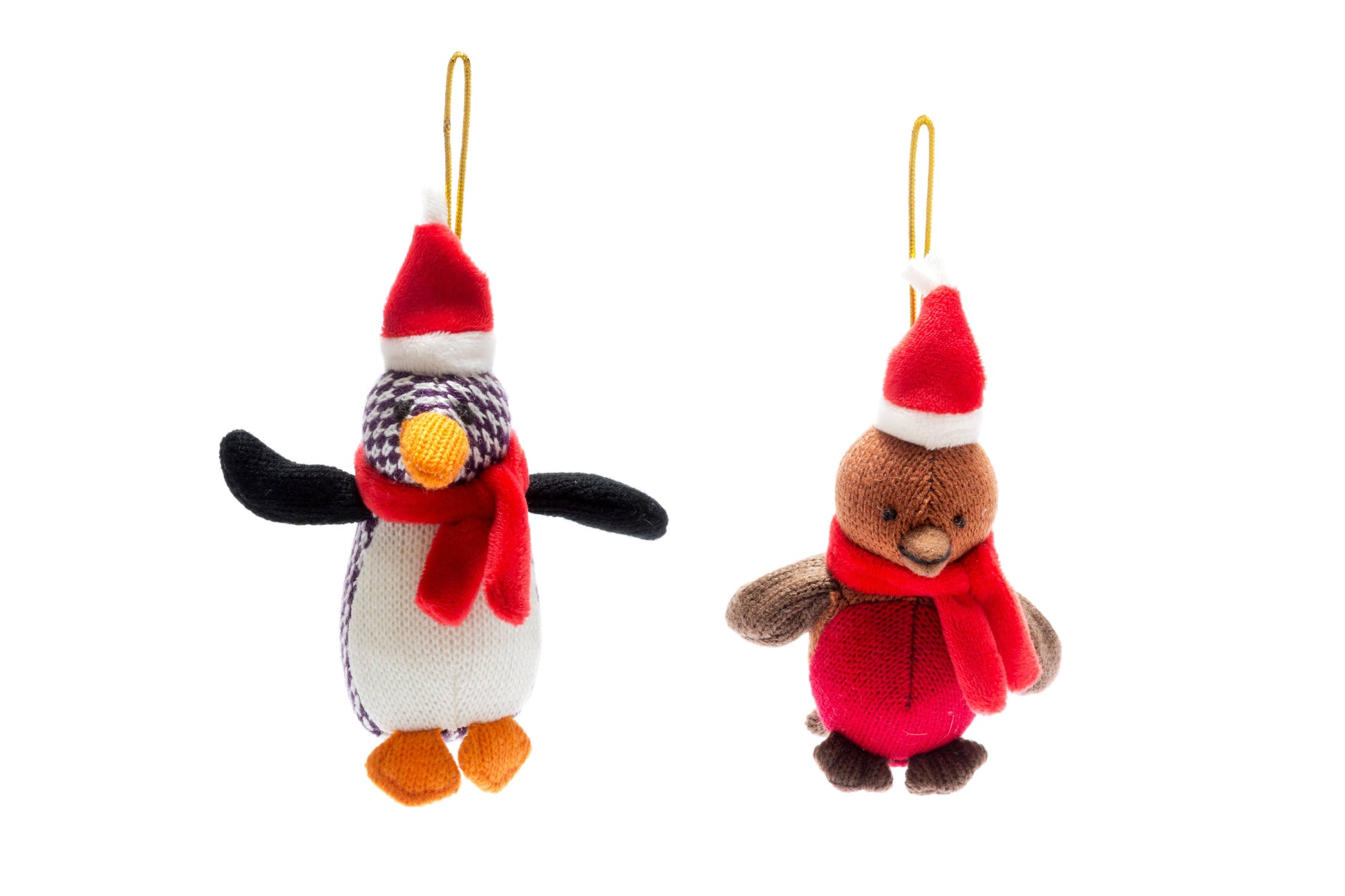 Two plush penguin ornaments with festive hats and scarves on a white background