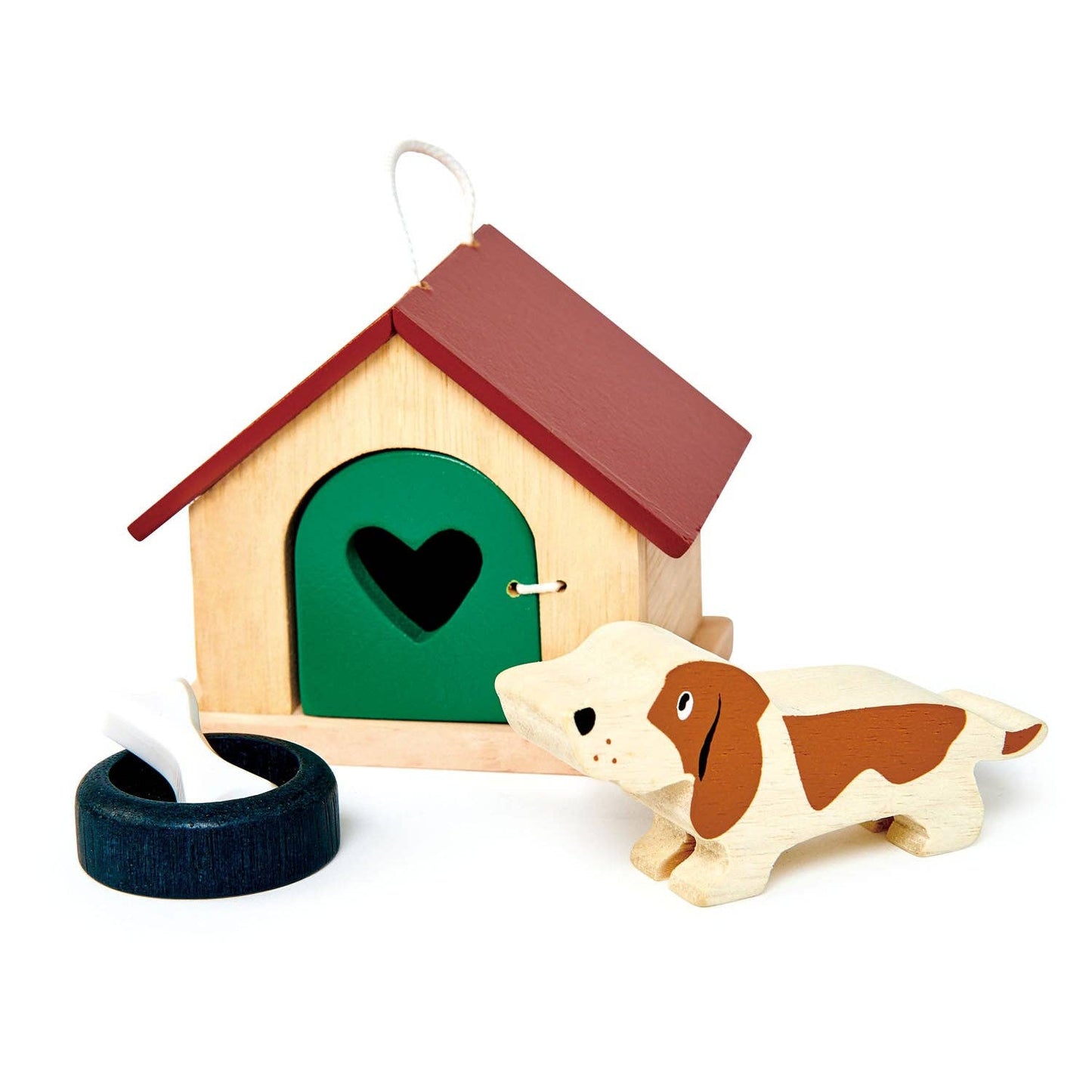 Wooden doghouse with a heart-shaped door, a dog toy, and a ring on a white background